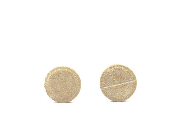 Macro view of pill or tablet isolated over white background