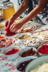 Male chef preparing dough for pizza in outdoor market. Street food.