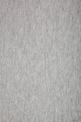 Fototapeta na wymiar Real heather grey knitted fabric made of synthetic fibres textured background