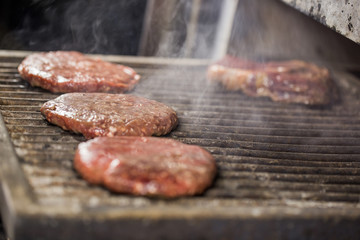 Big beef or pork cutlets on a josper grill for party cooking