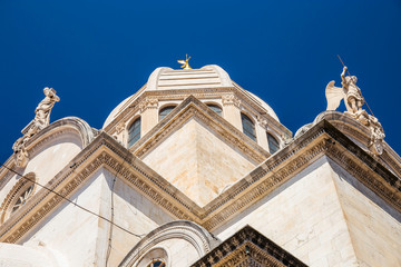 Fototapeta premium Croatia, city of Sibenik, cathedral of St. James, triple-nave basilica, detail of dome and sculptures on roof