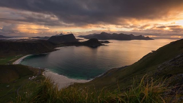 Timelapse of sunset at Haukland beach view from Mannen mountain peak in Lofoten archipelago, Norway, Scandinavia, Europe 