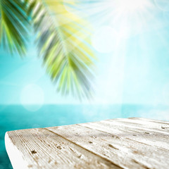 Desk of free space and summer beach background 