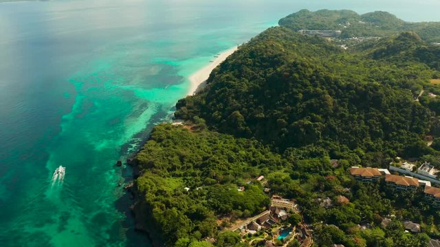 Tropical white sand beach, hotels near the blue lagoon and corall reef. aerial view, Boracay, Philippines. Seascape with beach on tropical island. Summer and travel vacation concept.