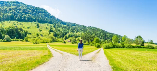 A choice of two ways. Woman at a crossroads. © patma145