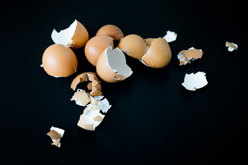 Chicken egg shell on black background, focus selective