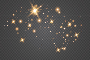 Set of gold glowing light effects isolated on dark background. Glow light effect. Star exploded sparkles.