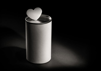 donation box and heart shape in the dark