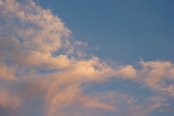 The sky at sunset with orange clouds. Background, texture