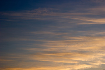 Naklejka na ściany i meble The sky at sunset with orange clouds. Background, texture