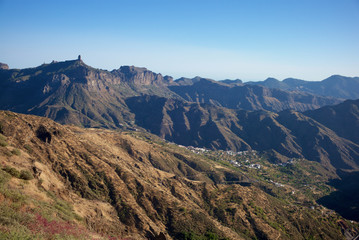 Panorama of the caldera de Tejeda with the Roque Nublo in the distant background. Gran Canaria is one of the seven islands of the Canary archipelago.