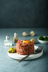 Homemade beef tartare with egg yolk