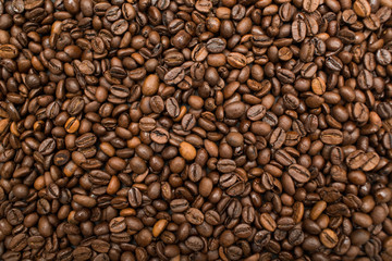 Roasted coffee beans brown seeds texture background wallpaper.