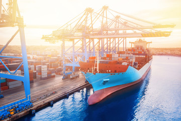 Large container ship cargo loading and unloading in deep sea port with crane. Concept import export...