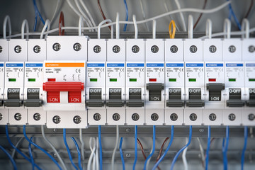 Automatic circuit brakers in a row. Electric switches in fusebox.