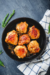 Delicious fried chicken thighs in a cast iron skillet