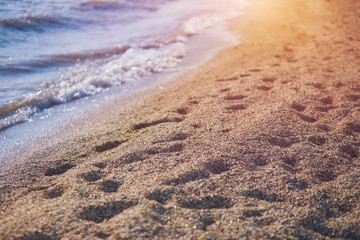 sand beach and blue sea water at summer day