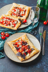 Tomato tarts with addition of aromatic herbs
