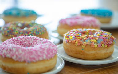 Doughnuts assorted on wood. Close up view
