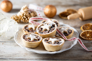 Homemade festive mince pies on white plate