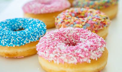 Doughnuts assorted on white. Close up view