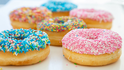 Doughnuts assorted on white. Close up view
