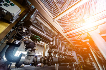 Interior of modern natural oil factory. The piping, pumps and motors