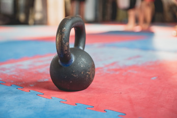 Naklejka na ściany i meble kegelbel in gym on tartan, postponed after a hard fizzy exercise