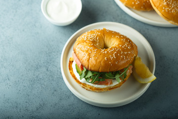 Salmon arugula bagel with cream cheese
