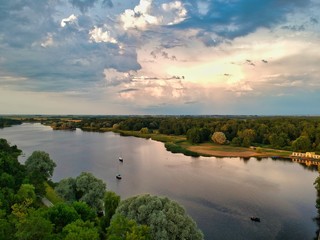 Naklejka premium landscape with river and clouds