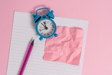 Striped paper sheet note pencil vintage alarm clock colored background