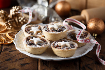 Homemade festive mince pies on white plate