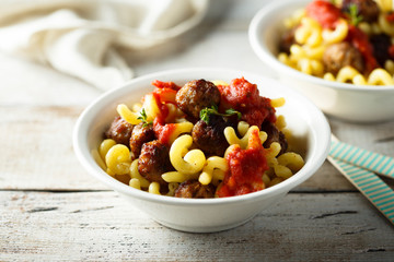 Homemade pasta with meatballs and tomato sauce