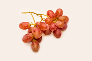 Red ripe grapes on neutral background