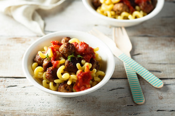 Homemade pasta with meatballs and tomato sauce
