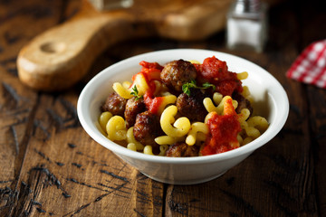 Homemade pasta with meatballs and tomato sauce