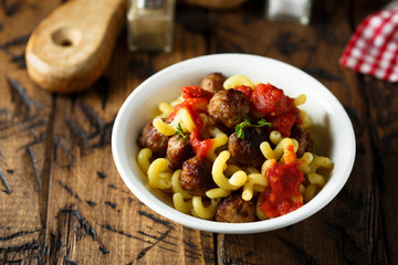 Homemade pasta with meatballs and tomato sauce