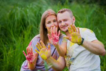 Fototapeta premium Young couple on Holi color festival.