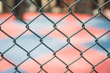 Gorgeous woman, mma fighter in gym during training. Preparing for a hard caged match