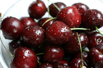 Fresh wet summer cherries with droplets
