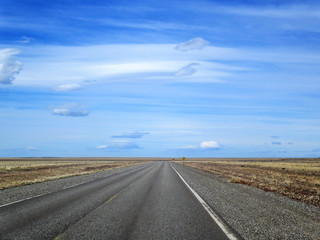 travel in Patagonia on a long road througt scenic landscape
