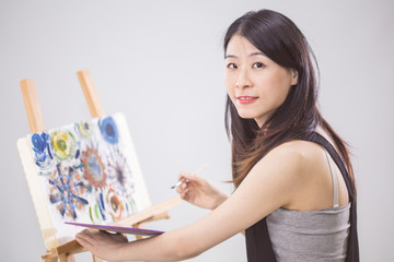 Artist painting on an easel