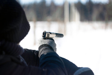 guy aiming with a pistol