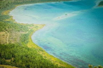Obraz premium Mountain lake aerial view landscape steppe hills and clouds summer rest tourism
