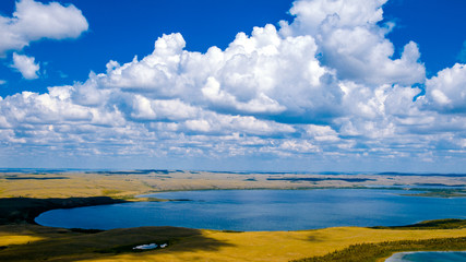 Mountain lake aerial view landscape steppe hills and clouds summer rest tourism