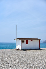 small house in front of the sea