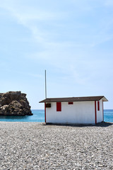 small house in front of the sea