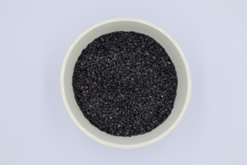 Poppy in a white cup on a white background