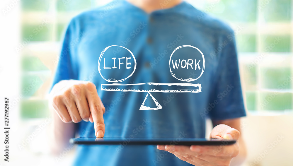 Wall mural Life and work balance with young man using a tablet computer