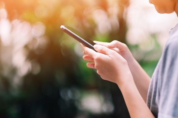 A girl searching some data from her smartphone